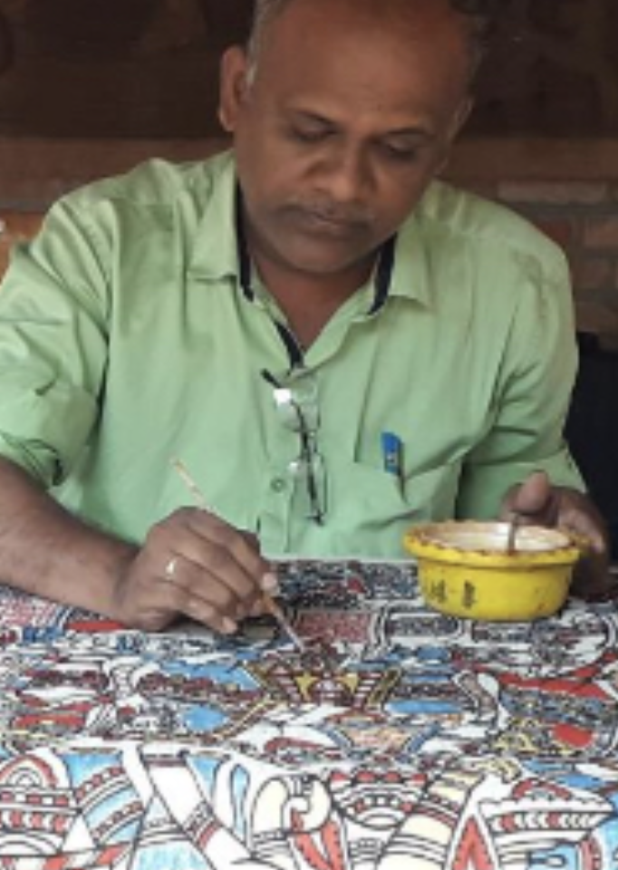 Artisan creating Karuppur Kalamkari art